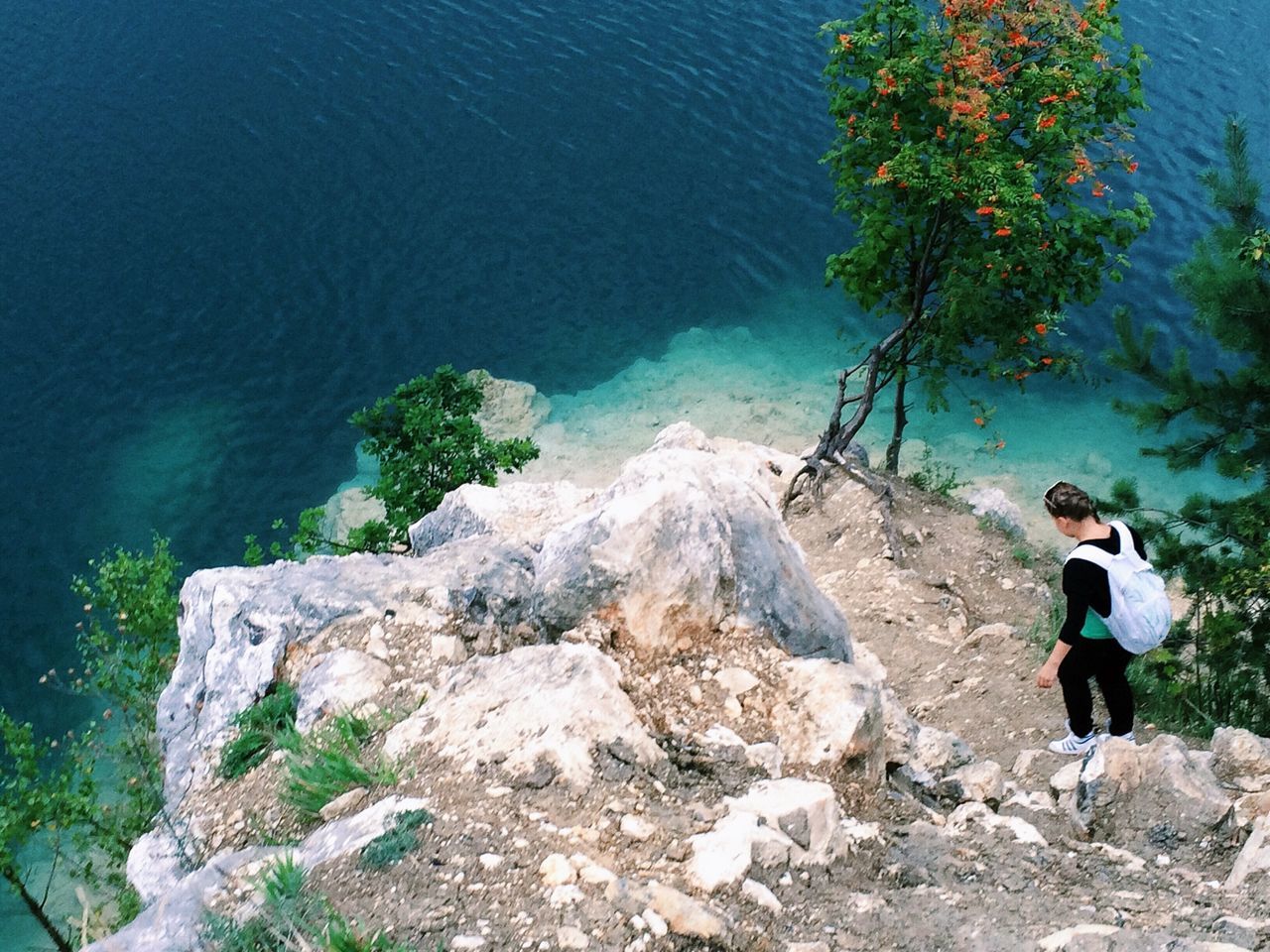 water, lifestyles, leisure activity, full length, high angle view, rock - object, sea, men, nature, casual clothing, standing, tranquility, rear view, vacations, beauty in nature, boys, day, childhood