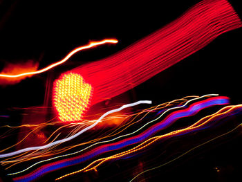 Light trails against sky at night