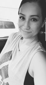 Portrait of beautiful woman in car