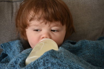 Close-up of a boy with drink
