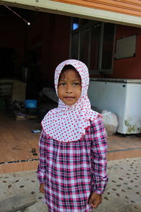 Portrait of cute girl standing outdoors