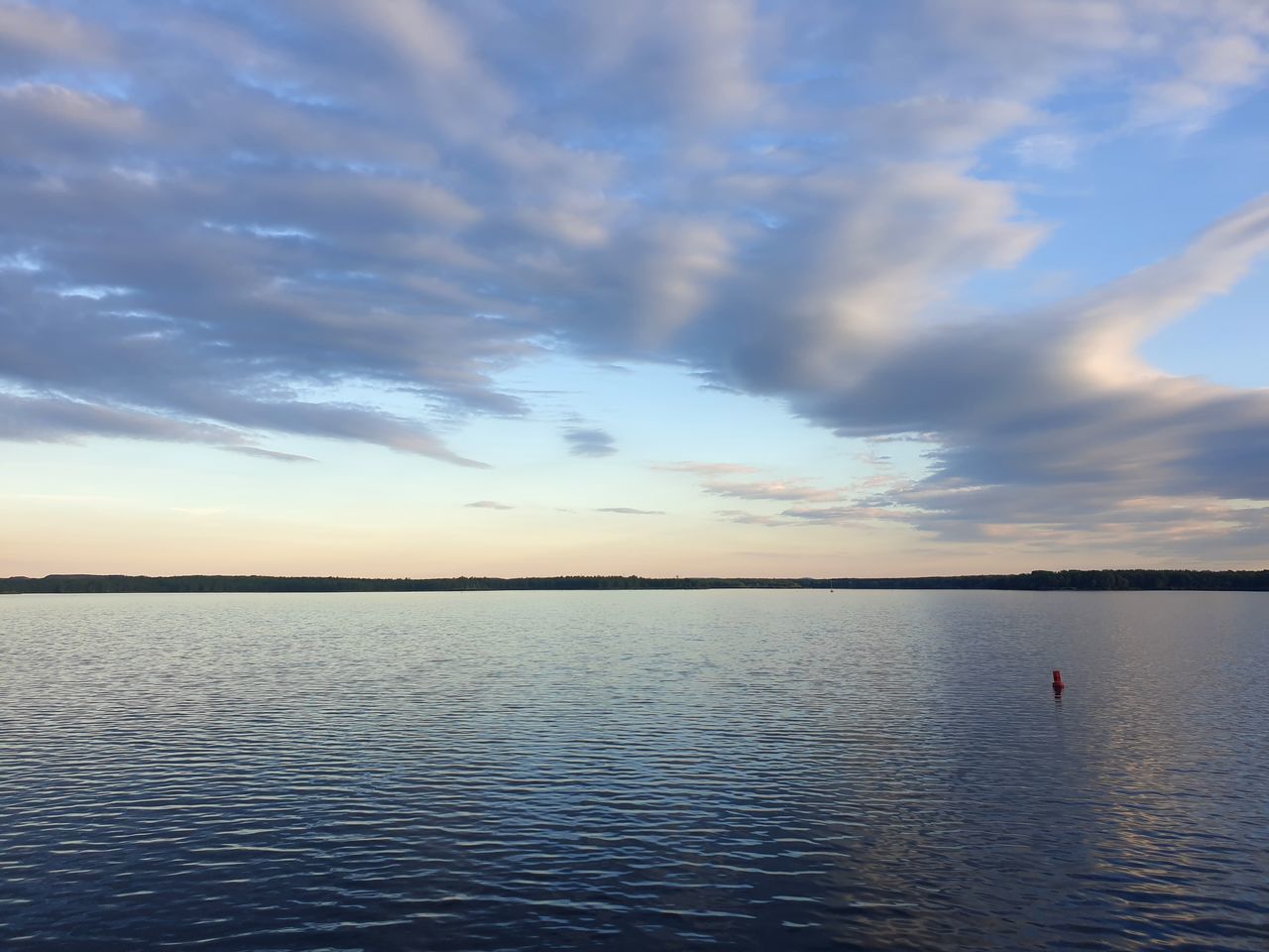 sky, water, cloud, reflection, beauty in nature, horizon, scenics - nature, sea, tranquility, nature, tranquil scene, sunset, shore, dusk, ocean, blue, idyllic, sunlight, horizon over water, outdoors, environment, dramatic sky, body of water, travel destinations, seascape, holiday, travel, trip, vacation, no people, beach, land, landscape, non-urban scene, rippled, day