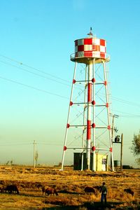 Low angle view of water tower against clear sky