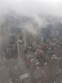 Aerial view of city during foggy weather