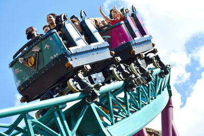 Low angle view of amusement park ride against sky