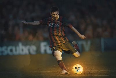 Low angle view of man playing soccer ball