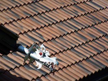 High angle view of toys on roof of building