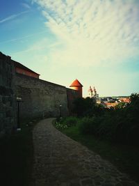 Street amidst buildings against sky