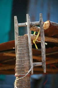 Close-up of rope tied on wood