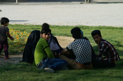 People relaxing on field