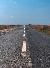 Surface level of road against sky