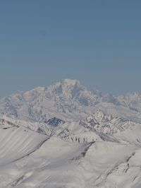 Scenic view of snowcapped mountain against sky.