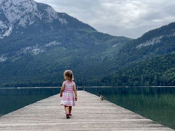 Rear view of woman looking at lake