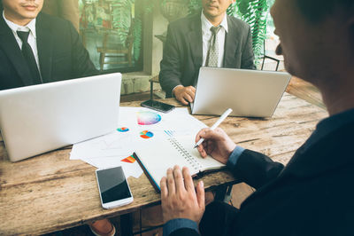 Group of people using mobile phone