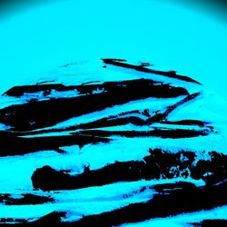 Close-up of blue sea against sky