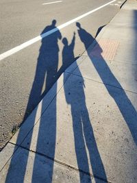 High angle view of shadows on street in city