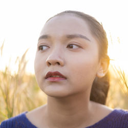 Portrait of a beautiful young woman looking away