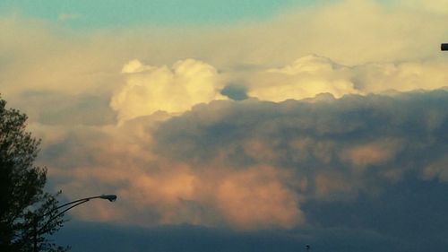 Low angle view of cloudy sky at sunset