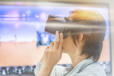 Close-up of man wearing virtual reality