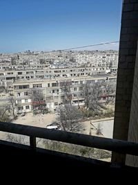 High angle view of buildings against clear sky