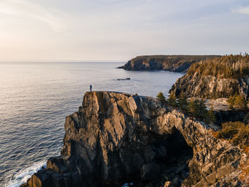 Berry head arch at sunrise, along the east coast trail of newfoundland, canada