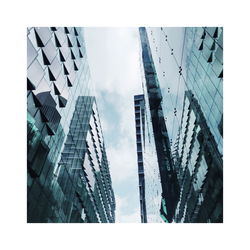 Low angle view of modern buildings against sky