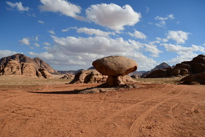 Panoramic view of arid landscape against sky