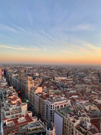 High angle view of city against sky during sunset