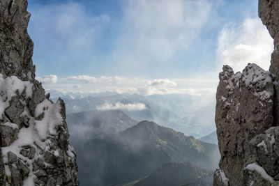 Scenic view of snowcapped mountains against sky