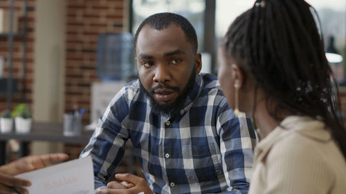 Business colleagues discussing at office