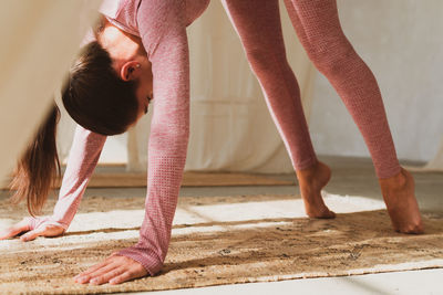 Young woman exercising at home