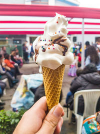 Cropped image of hand holding ice cream