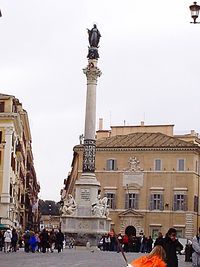 Tourists in front of building against clear sky