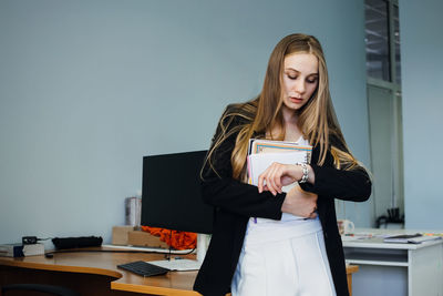 Multitasking skills employers, work burnout, tired at work. busy young blonde businesswoman with