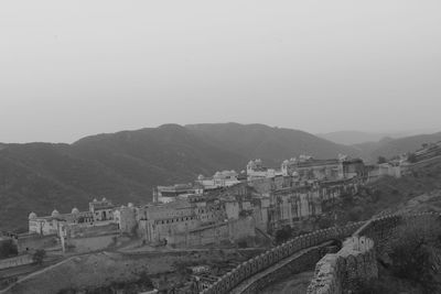 Built structure with mountains in background