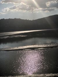 Scenic view of lake against sky during sunset