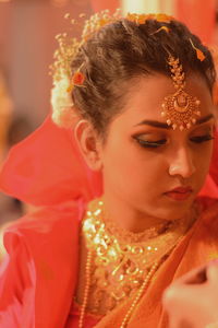 Close-up of young bride in traditional clothes