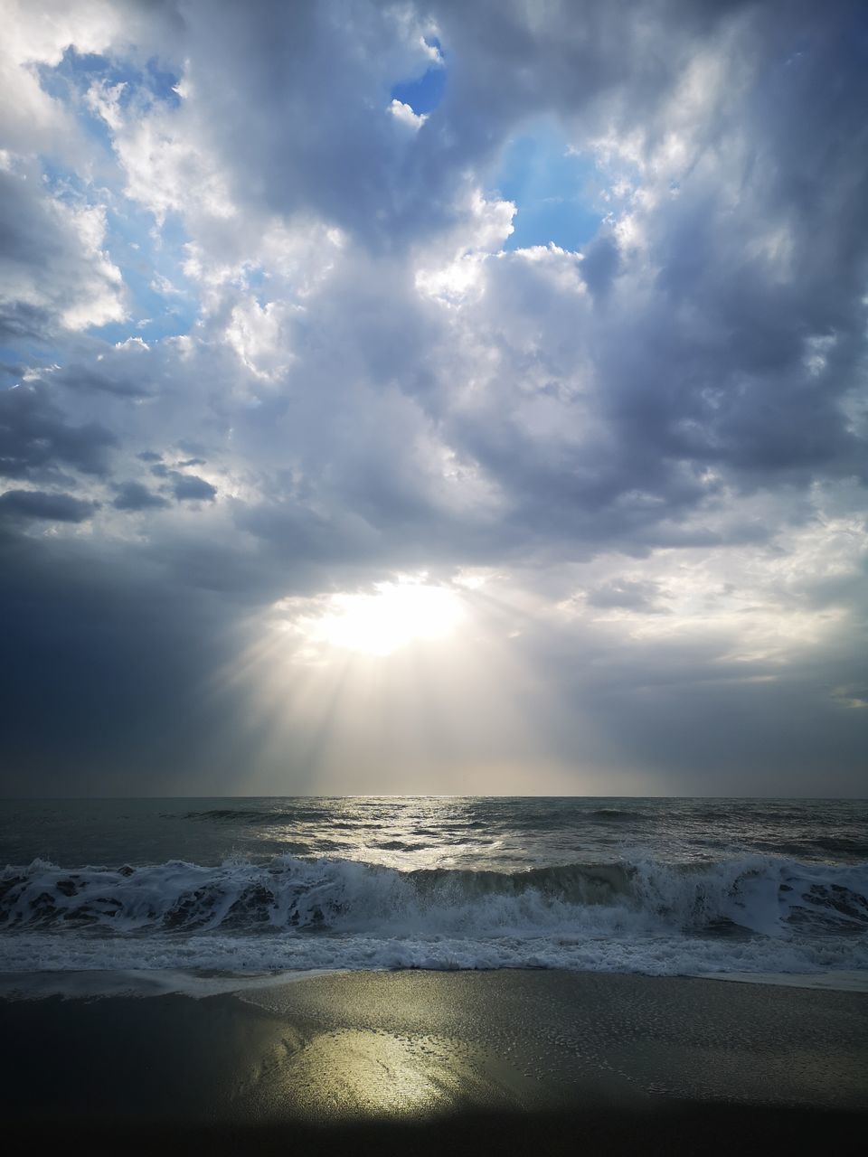 SCENIC VIEW OF BEACH AGAINST SKY DURING SUNSET