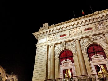 Low angle view of historic building against sky at night