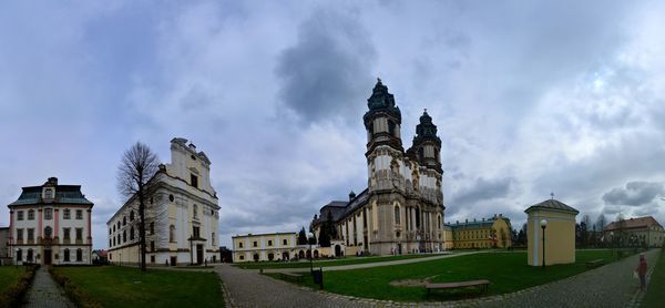 Low angle view of church against cloudy sky