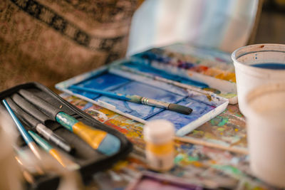 High angle view of paintbrushes on table