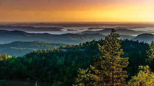 Scenic view of landscape against sky during sunset