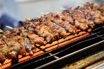 Close-up of meat on barbecue grill