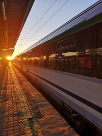 Train at railroad station against sky