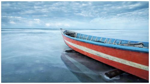 View of boat in water against sky