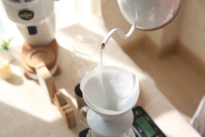 High angle view of water pouring in container