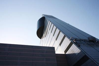 Low angle view of modern building against clear sky