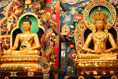 Low angle view of statue against temple building