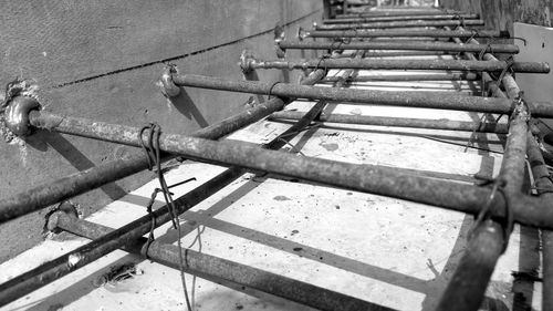 High angle view of old metal pipes on wall