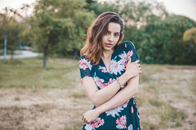 Portrait of woman standing on land